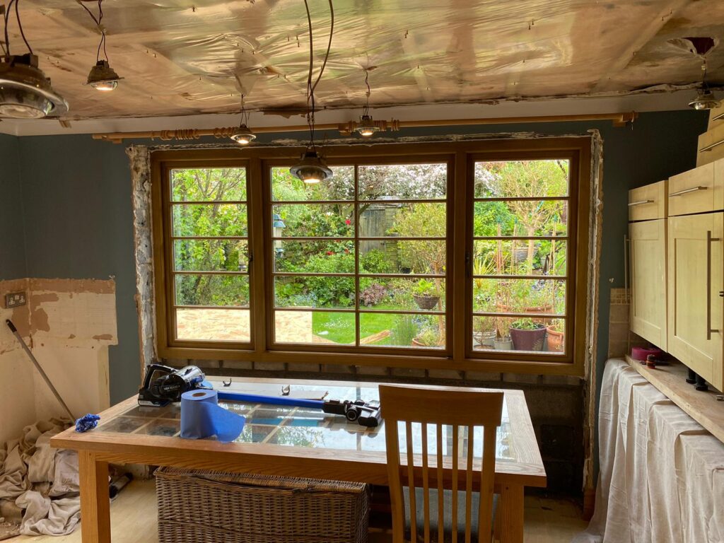 Interior view of garden room extension with timber-framed glazing in South Devon