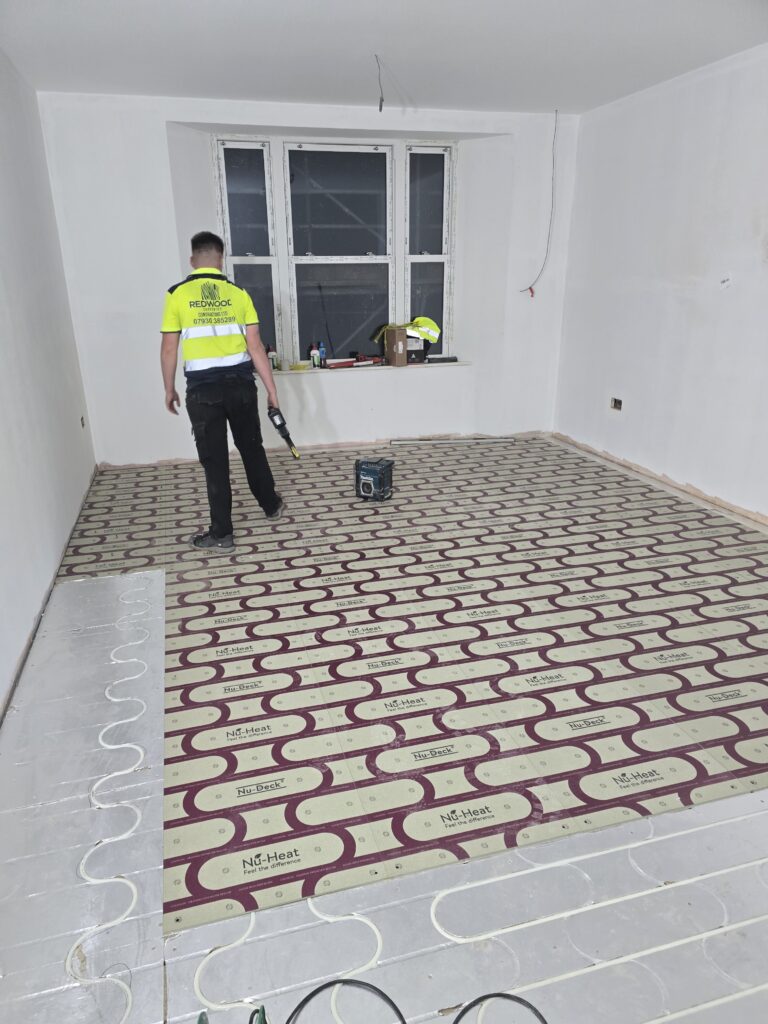 Underfloor heating installation during YMCA refurbishment