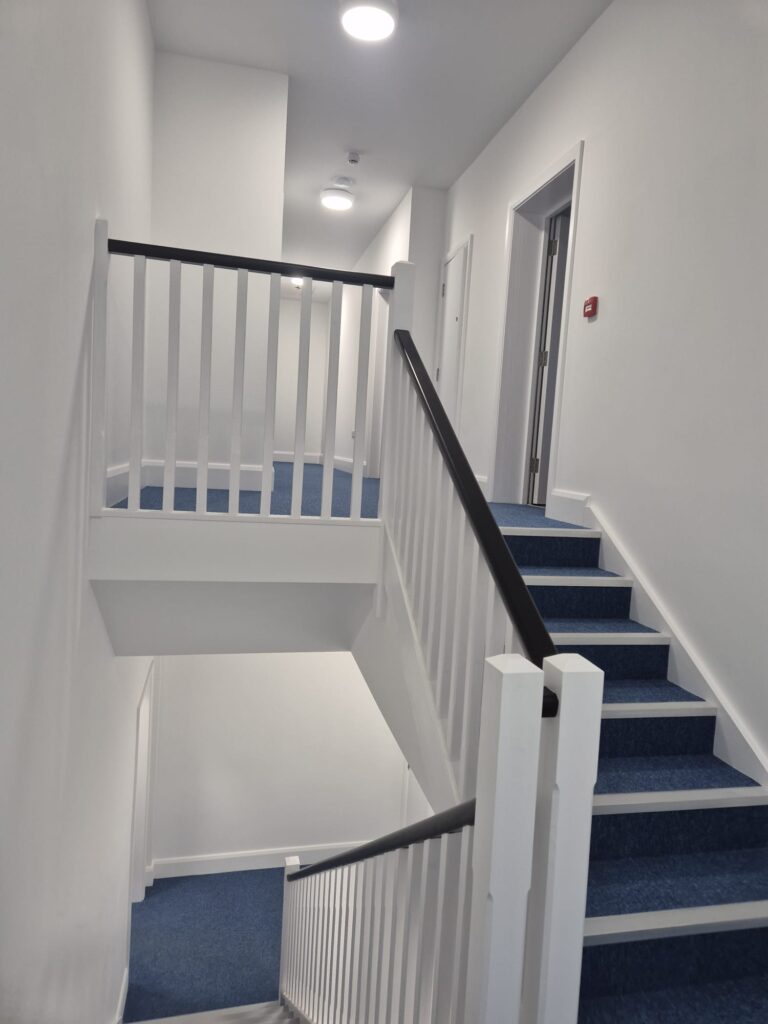 Carpeted staircase and carpentry at YMCA assisted living accommodation
